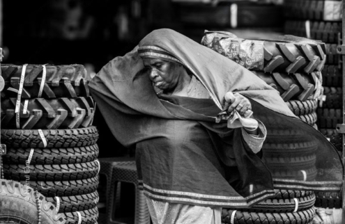 Woman with the Stacks of Tires