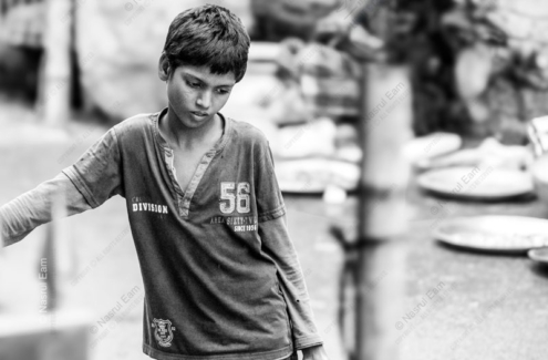 Young Boy with Downcast Eyes