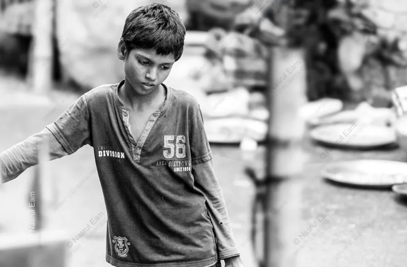 Young Boy with Downcast Eyes