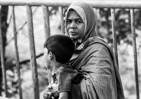 Mother and Son by the Iron Railing
