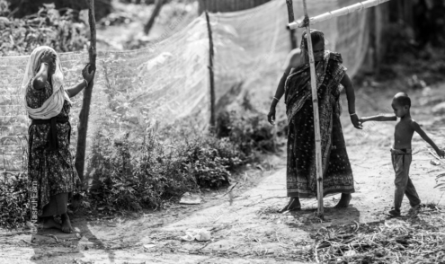 A Woman at Rest, a Mother and Child Walking