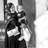 A Woman's Smile, Her Child in Arms