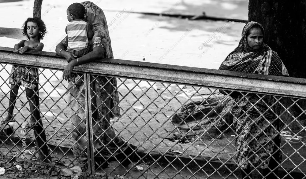 Women and Children at the Wire Fence
