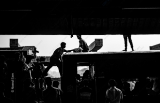 Rooftop Travelers at the Station