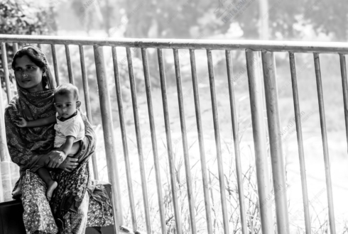 Mother and Child by the Roadside Railing