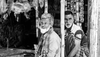 Three Figures in a Market Stall