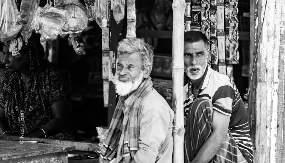 Three Figures in a Market Stall