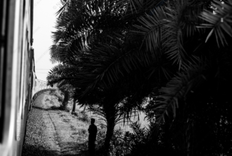 A Solitary Figure by the Tracks