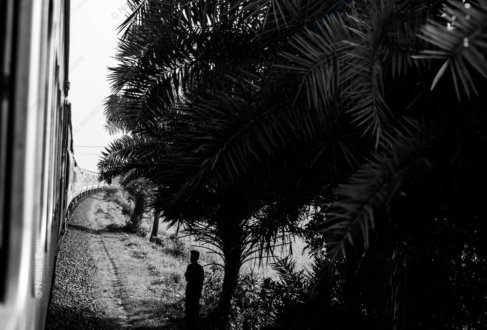 A Solitary Figure by the Tracks
