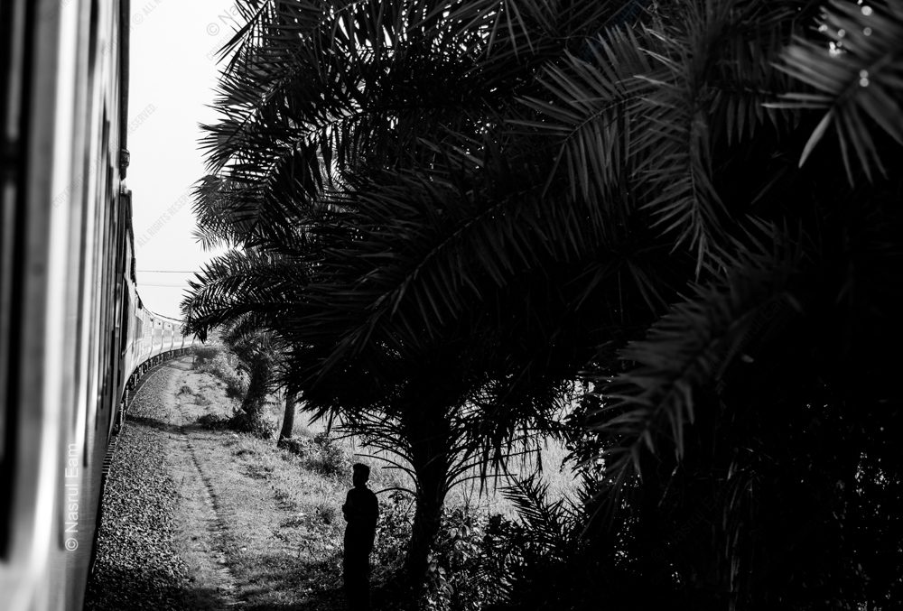 A Solitary Figure by the Tracks