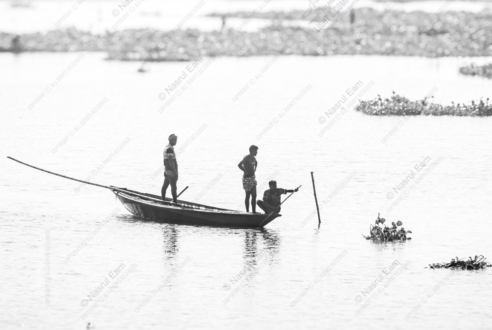 Three Men on Still Water