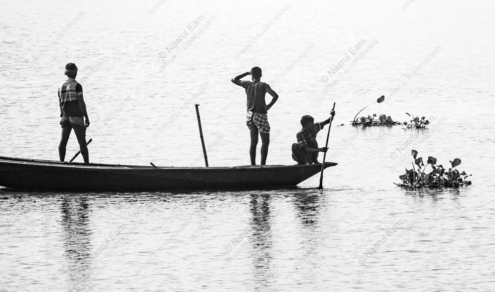 Three Figures on a Sunlit River