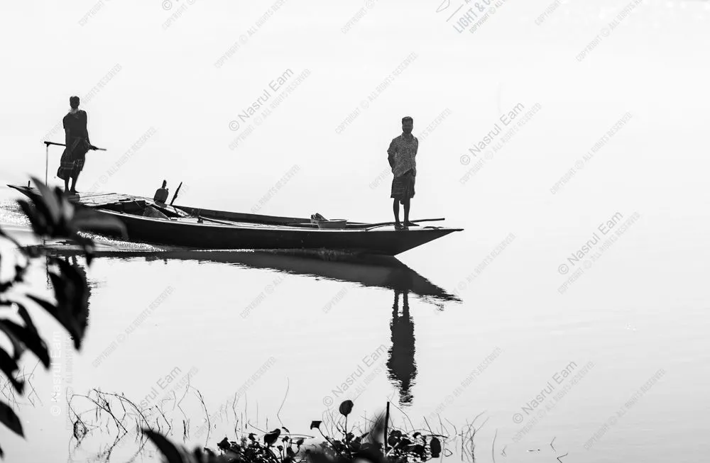 Two Figures on a Still River