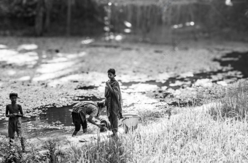 Three Figures at the Water's Edge