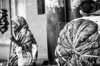 Elderly Woman and Resting Youth by the Roadside