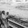 A Blind Man and His Family on the Tracks
