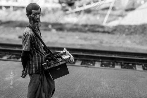 The Vendor by the Railway Tracks