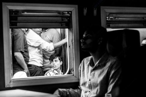 The Boy in the Carriage Window