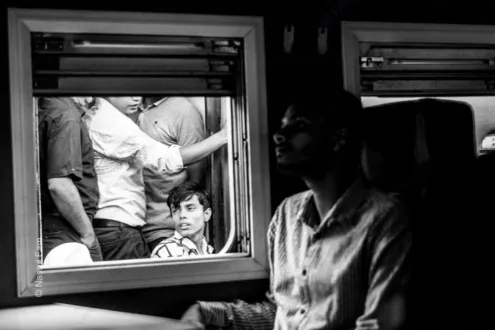 The Boy in the Carriage Window