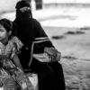 A Young Girl and a Veiled Woman