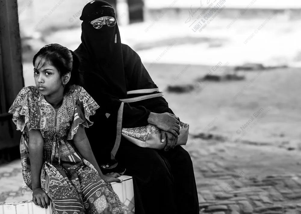 A Young Girl and a Veiled Woman