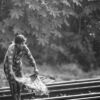 A Young Woman on the Train Tracks