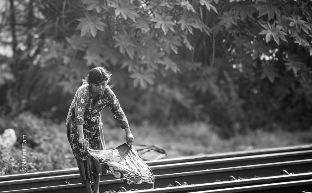 A Young Woman on the Train Tracks