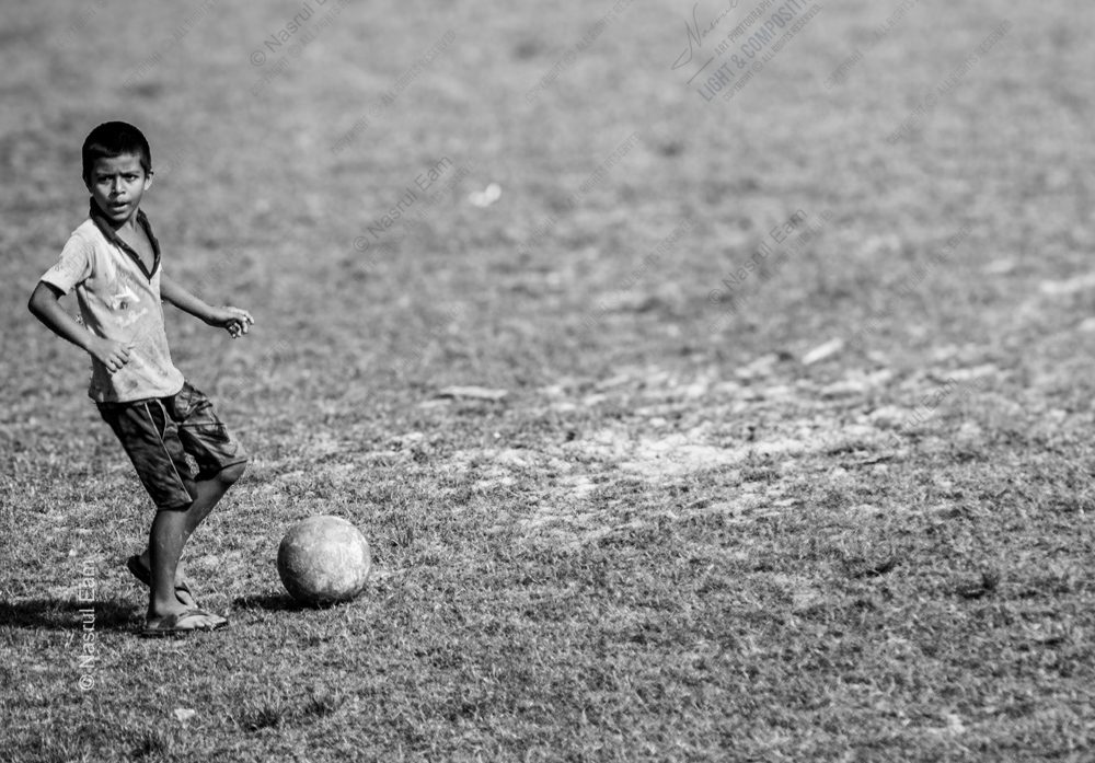 The Boy on the Grass Field