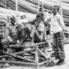 Workers Resting on a Bamboo Bench