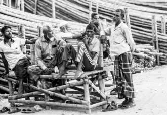 Workers Resting on a Bamboo Bench
