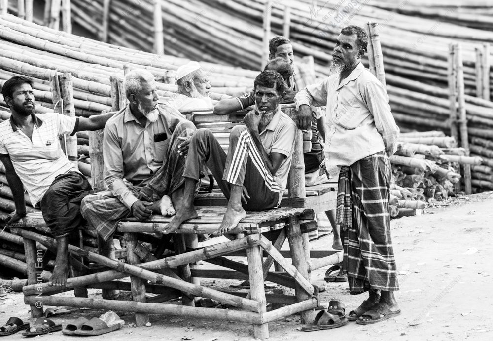 Workers Resting on a Bamboo Bench
