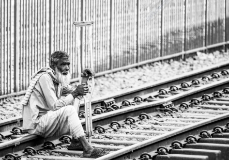 A Solitary Pause on the Railway Tracks