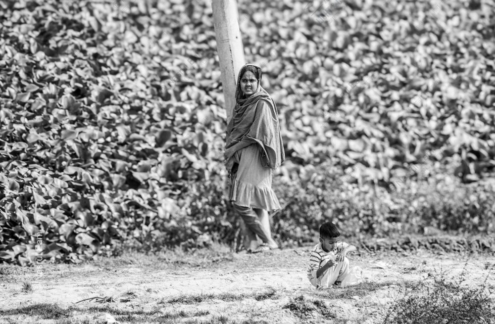 Standing Beside a Utility Pole with a Child