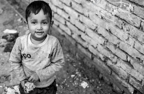 A Young Face, A Worn Wall