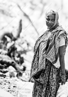 Woman in Printed Sari Standing by the Tracks