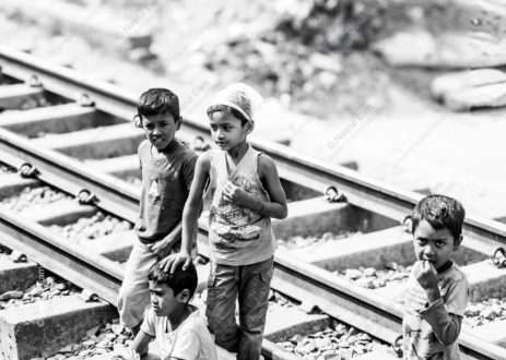 Children Standing Along the Railway Tracks