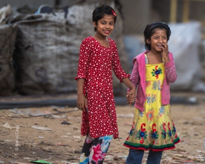 Two Young Girls Walking Hand in Hand