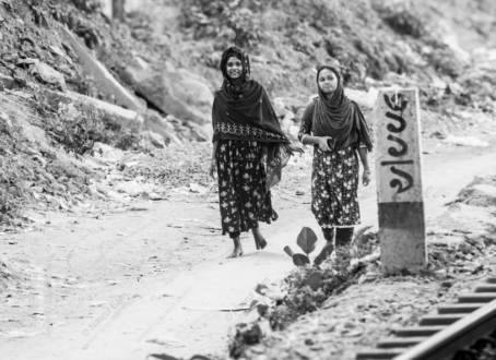 Two Young Women Walking Along the Railway Tracks
