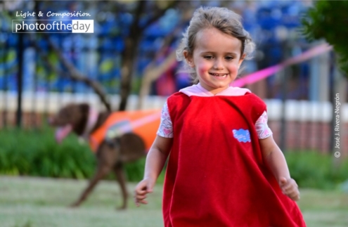 The Child in Red by Jose Juniel Rivera-Negron - Photojournalism, Photography Awards, Award-Winning Photography, Child Photography, Portrait Photography